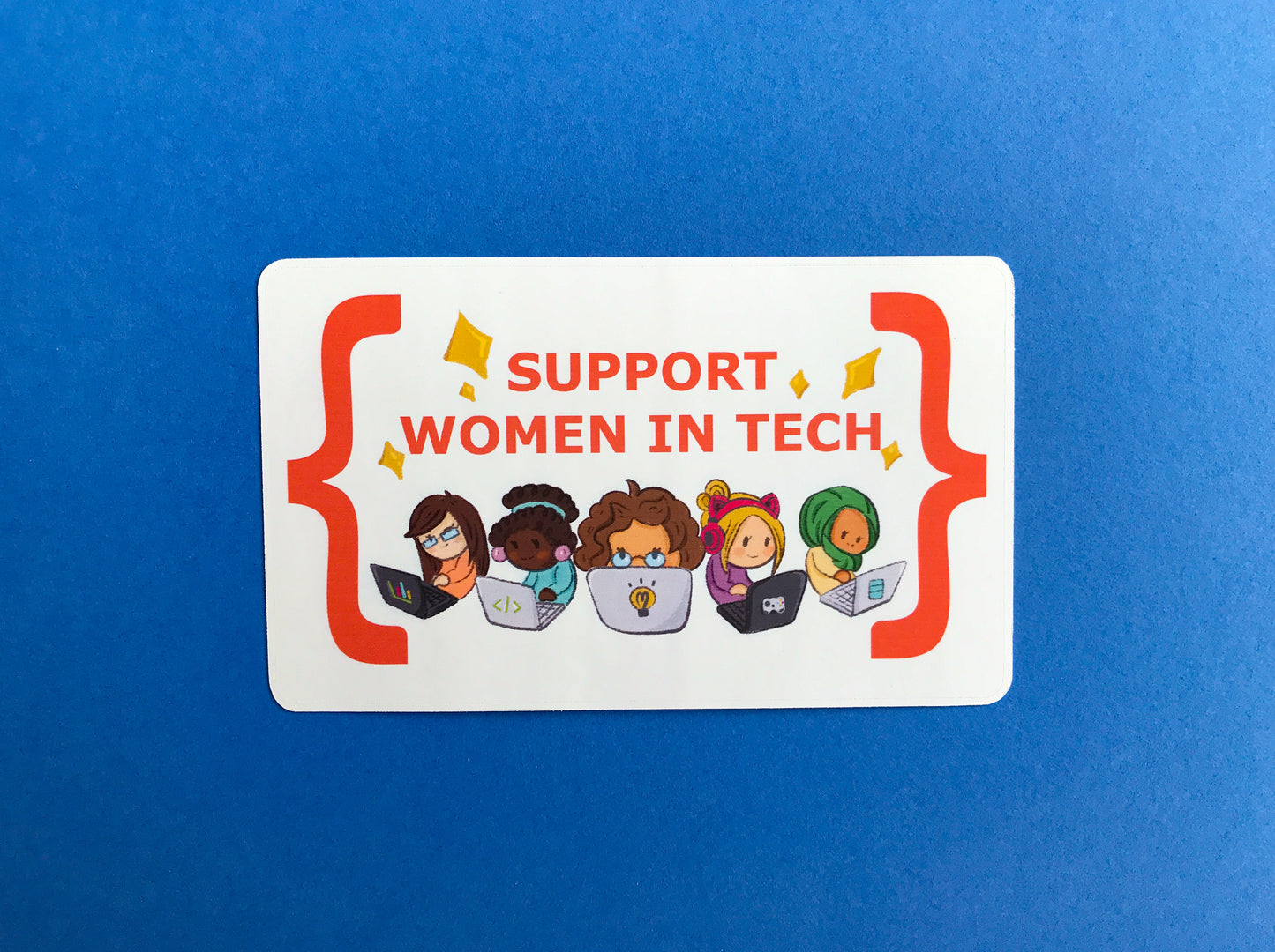 Sticker with 'Support Women in Tech' text and illustrations of women using laptops on a blue background