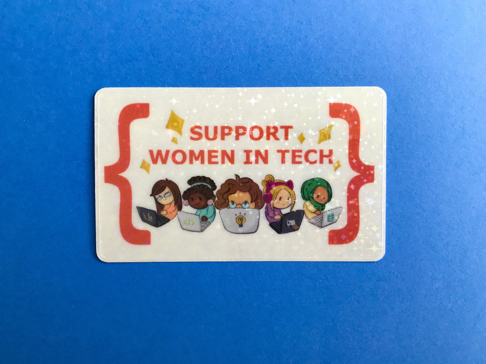 Sticker with illustrations of women using technology and text 'Support Women in Tech' on a blue background