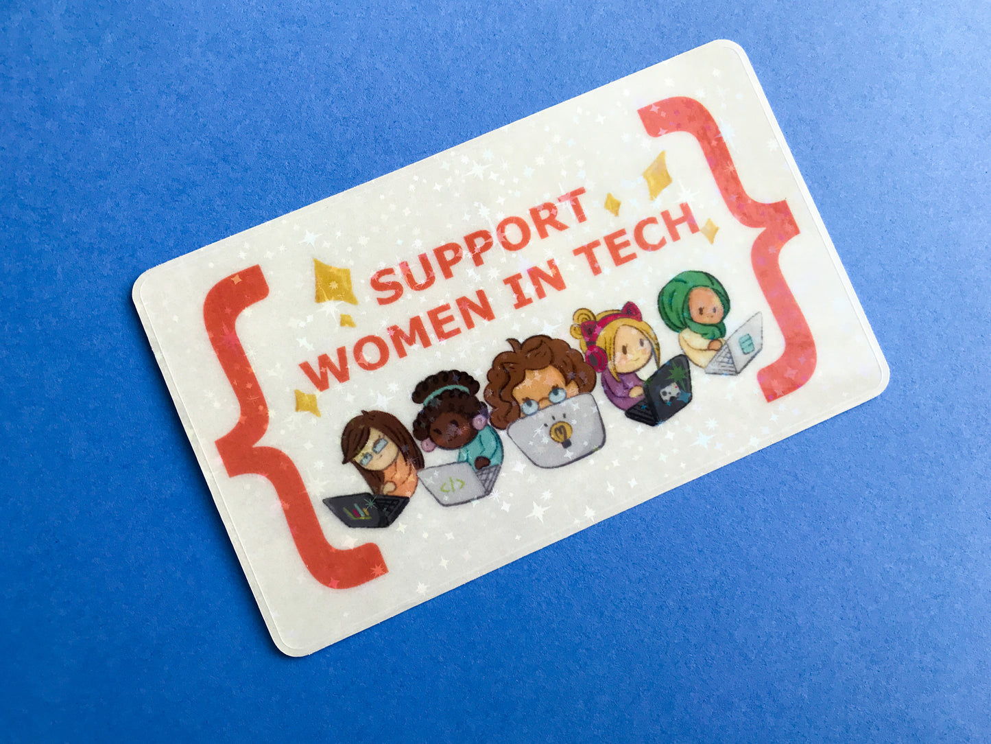 Sticker with illustrations of women working on computers and text 'Support Women in Tech' on a blue background