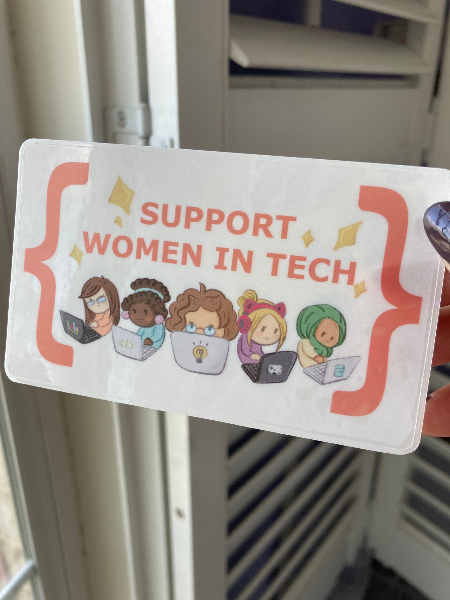 Sticker with 'Support Women in Tech' text and illustrations of women in various professions.