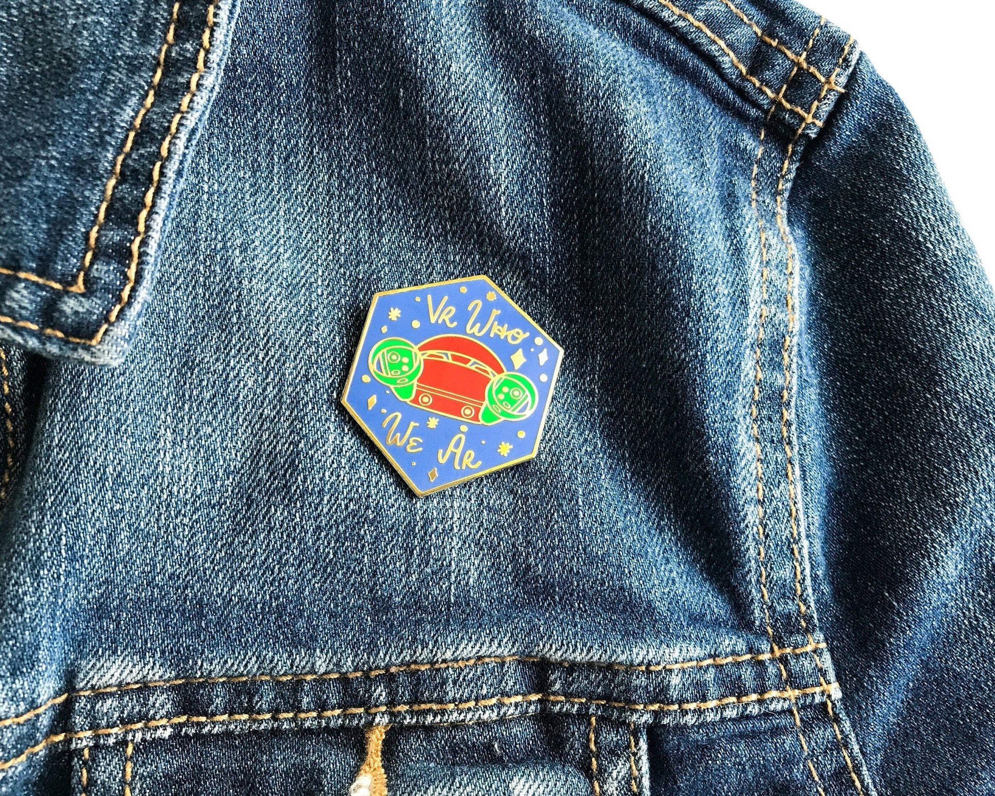 Colorful hexagonal pin on a denim jacket