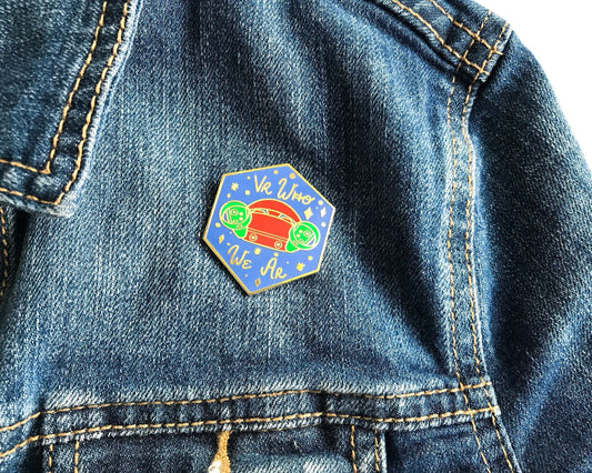 Colorful hexagonal pin on a denim jacket